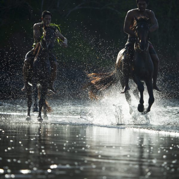 Tahiti HIVA Two Horsemen Riding Horses on Beach Ocean Tide Sea Spray