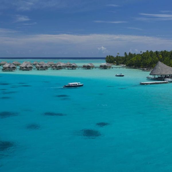 Tahiti Tahaa overwater bungalows boat in water pier