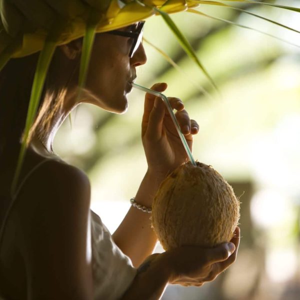 Tahiti Tikehau Woman Sipping Cocktail Cocanut Straw Hat