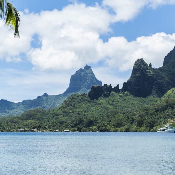 Tahiti moorea ocean clifs mountains blue sky boating