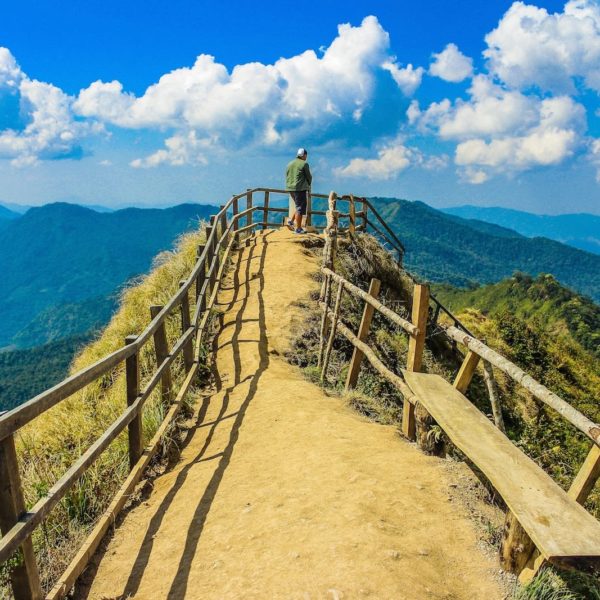 Luxury Thailand Vacation Photo Of A Man Standing In The Cliff Background Bench Cliff